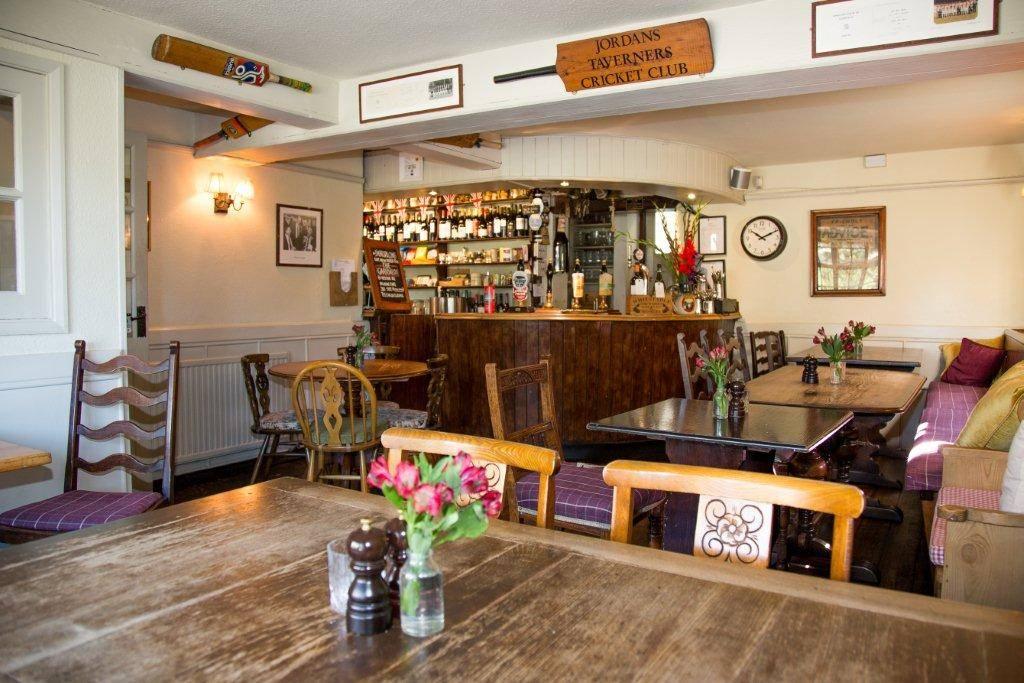 Interior of a pub with cricket bats on the wall