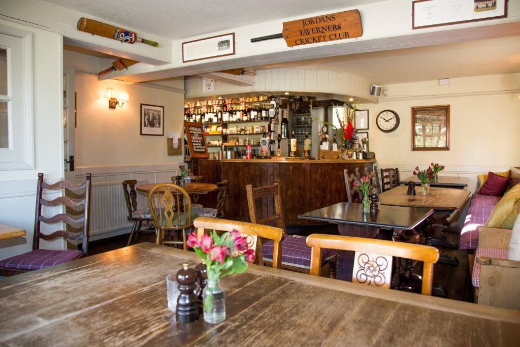 Interior of  a pub with cricket bats on the wall