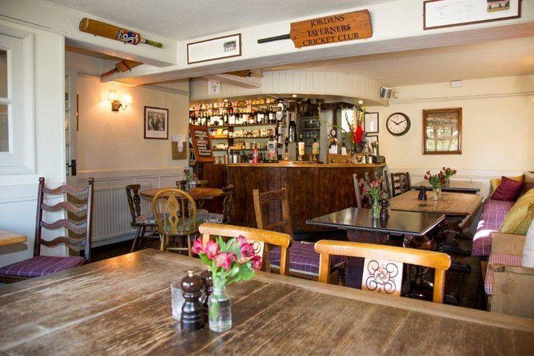 Interior of a pub with cricket bats on the wall