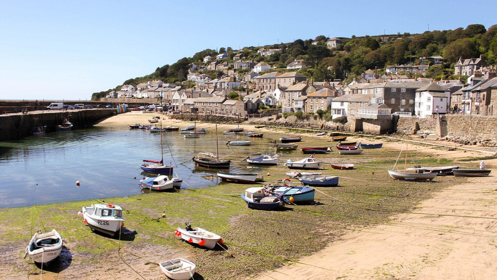 A view of St Ives beach with houses and boats