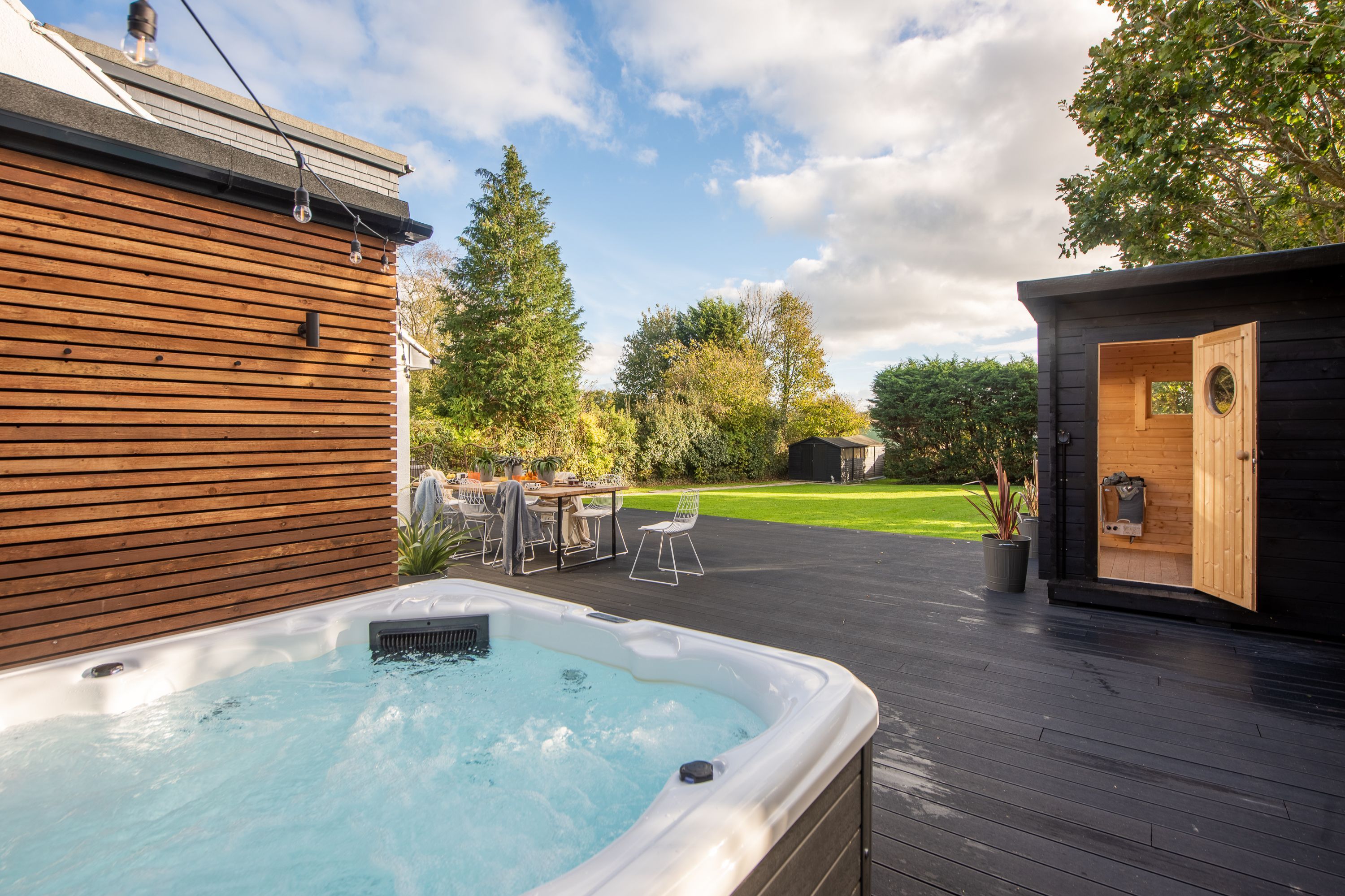 A hot tub in a large garden